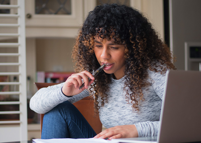 College graduate learning about investing and savings options to plan for their future