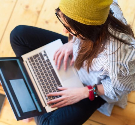 Student on Floor with Laptop