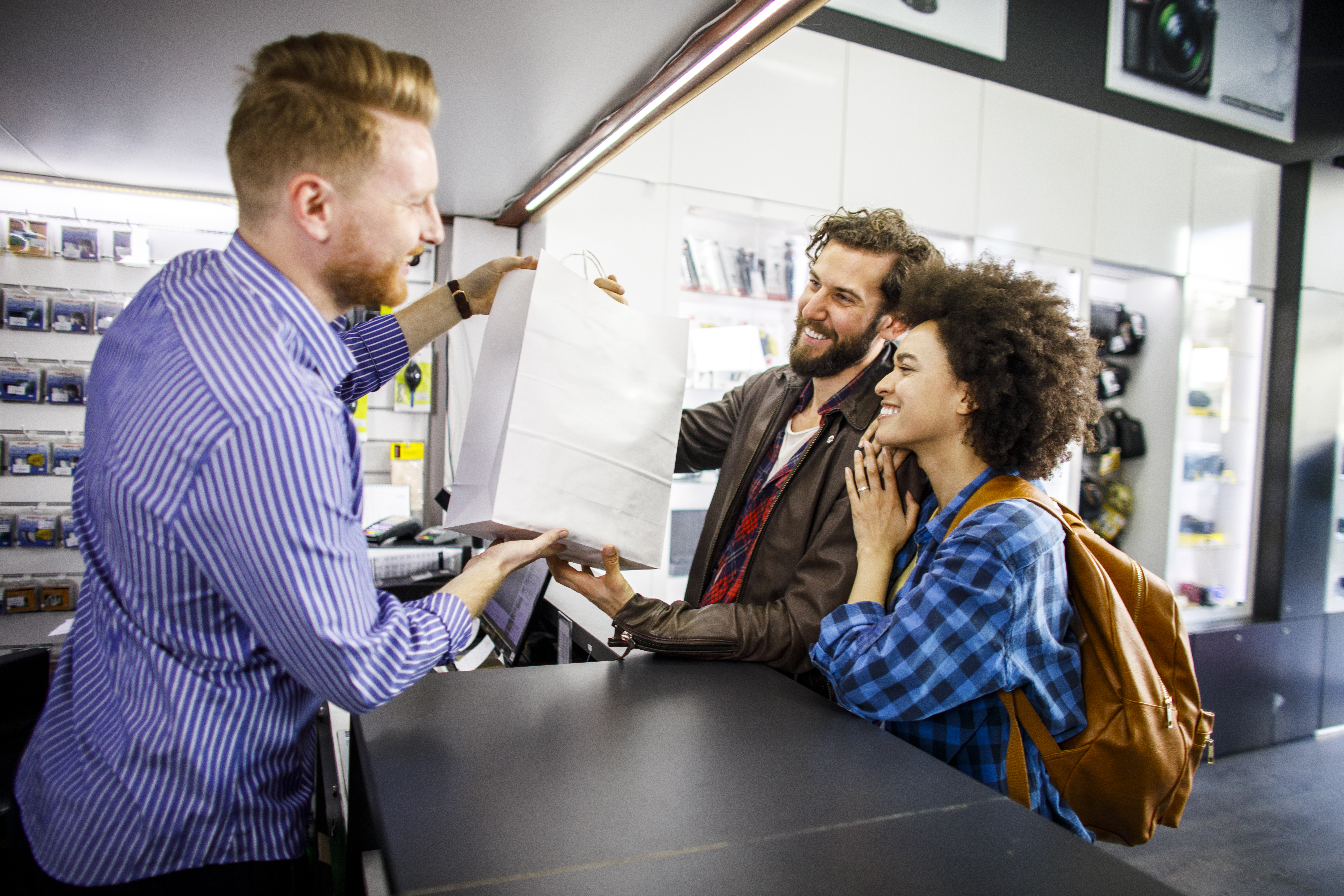 A couple makes a purchase in a retail store with a buy now, pay later transaction.