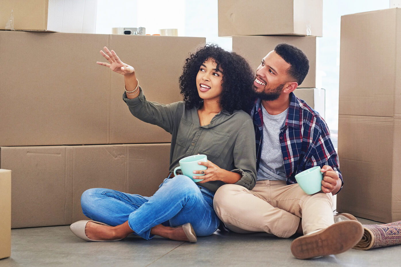 A couple imagines the layout of their first home after learning loan tips from UW Credit Union