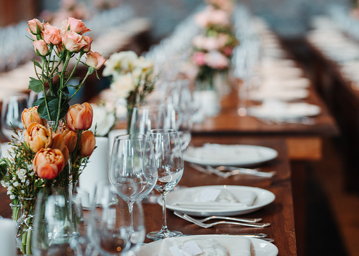 A long dining table is set after members learned how to pay for a wedding