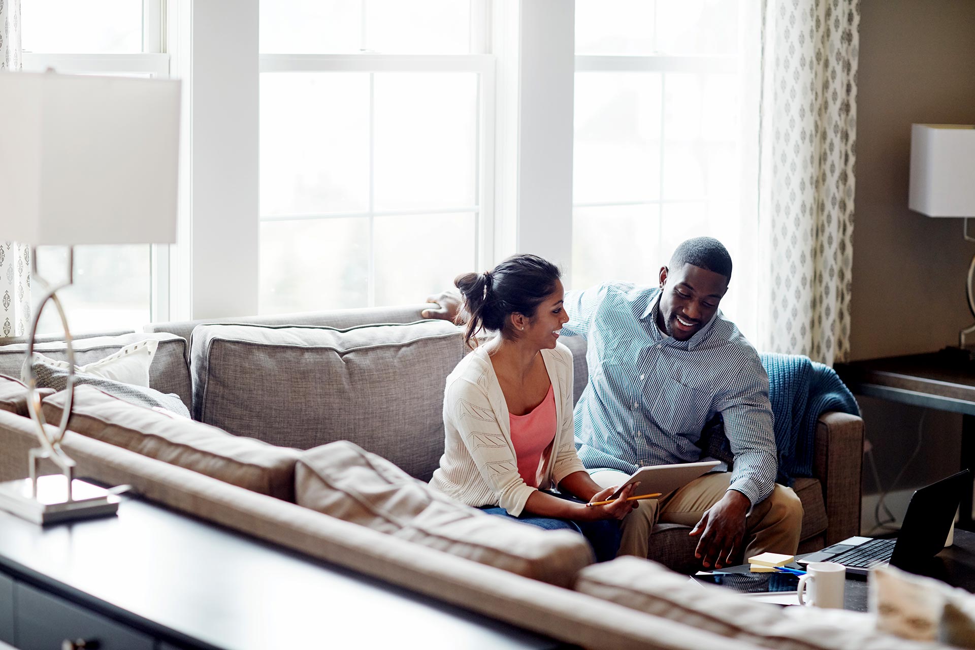 Couple talks over finances at home.