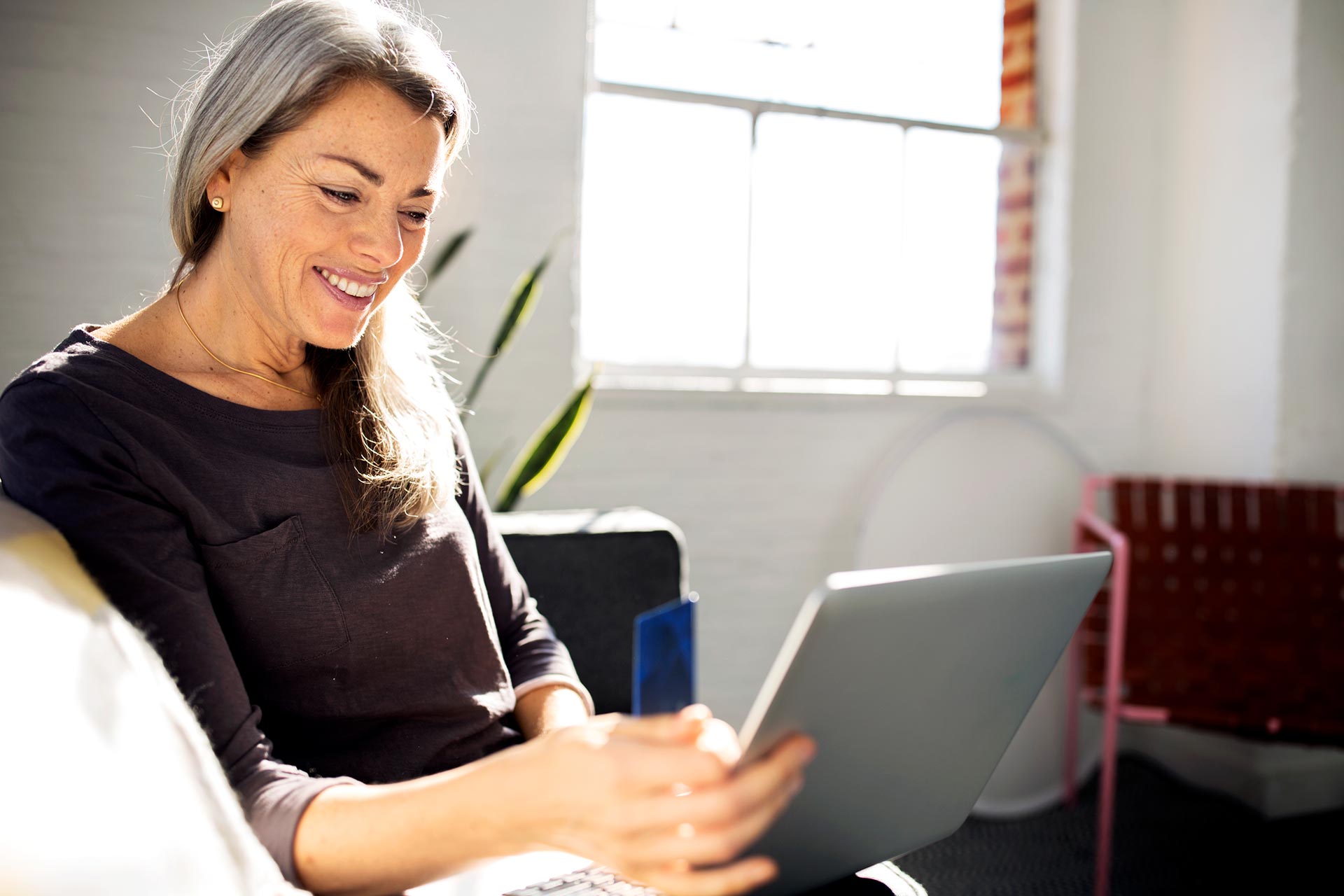 Woman discovering the difference between a HELOC vs Home Equity Loan vs a Personal Loan with the help of UW Credit Union.