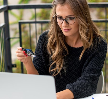 Woman with Card and Laptop