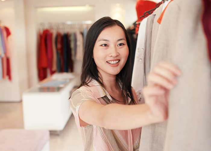 woman shopping after understanding common credit score myths