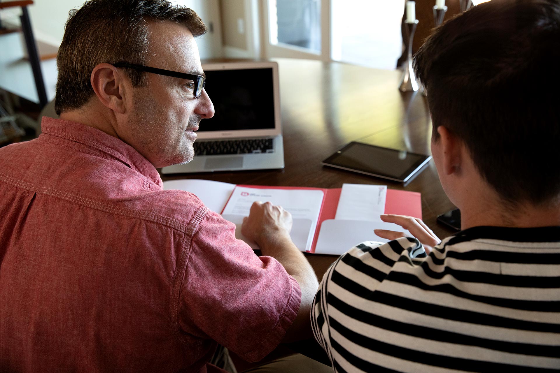 Man and woman reviewing their finances together. 