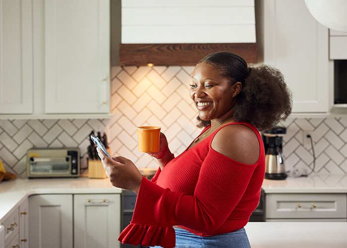 Women smiles as she found the right checking account | UW Credit Union