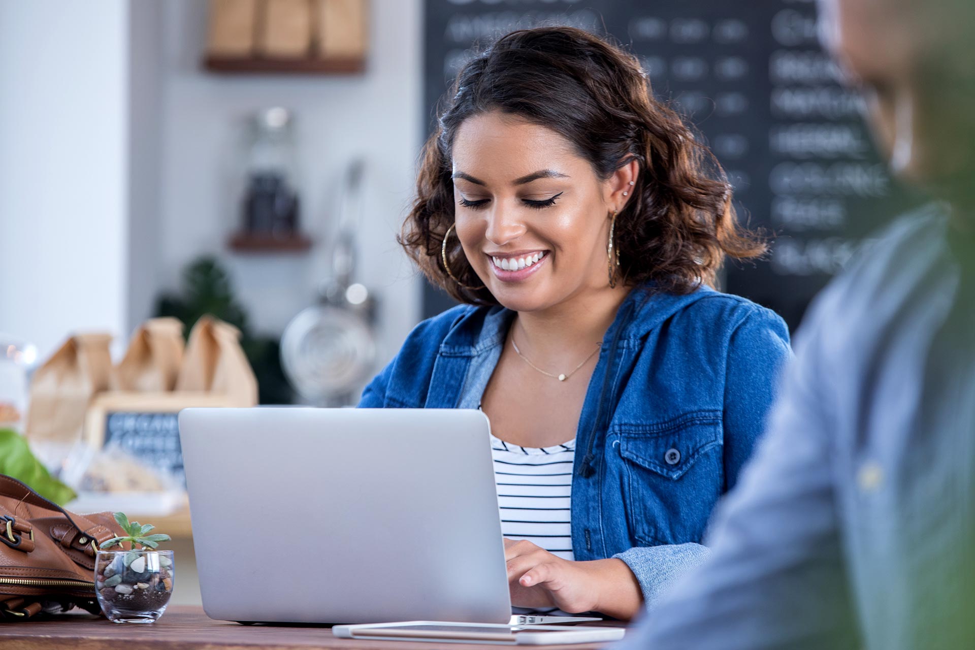 Women uses laptop to view her preapproval.