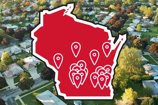 A icon of the state of Wisconsin is overlaid on a top down image of a real suburb.